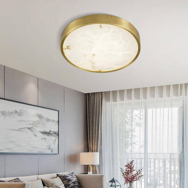 Plafonnier design LED rond en marbre avec bords dorés