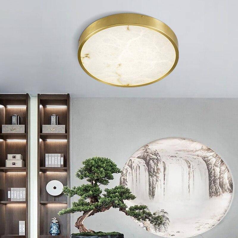 Plafonnier design LED rond en marbre avec bords dorés