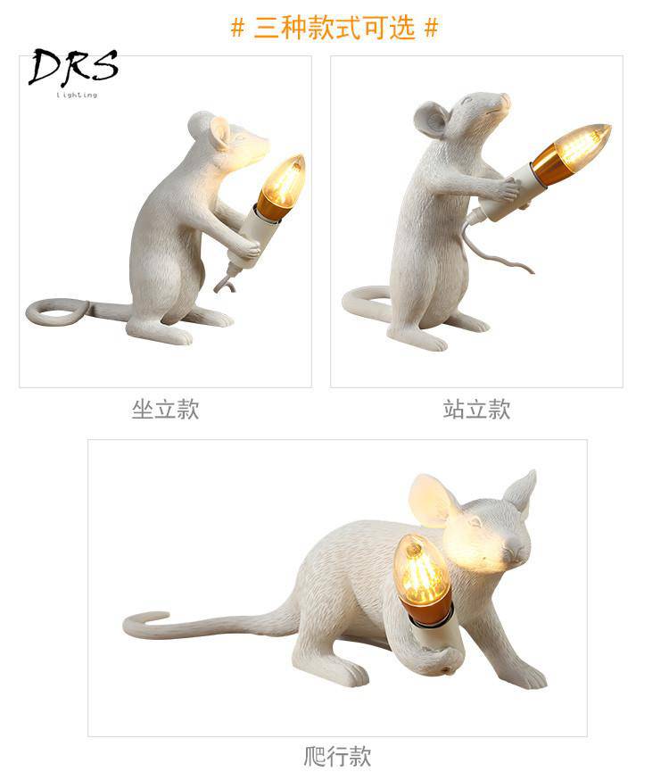 Lampe à poser en forme de souris tenant une lampe