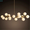 lustre design en métal doré et lampes en boules