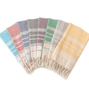 Serviette de plage coton motif jacquard losanges pompons