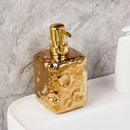 bouteille en céramique dorée décor lune pour lotion