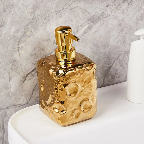 bouteille en céramique dorée décor lune pour lotion