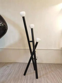 Lampadaire design batons croisés