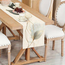 Chemin de table motifs feuilles abstraits style botanique