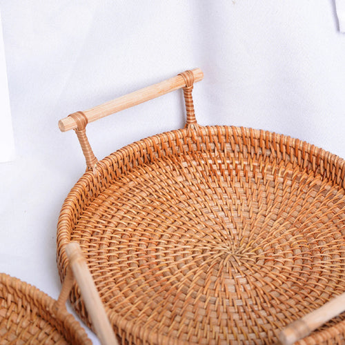 panier rond en rotin tressé avec poignée pour rangement et présentation