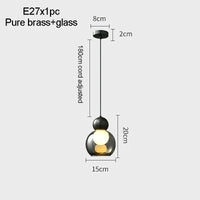 suspension en verre transparent avec tête en cuivre décorative