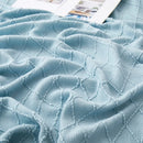 Plaid tricot jacquard à carreaux style nordique pompons