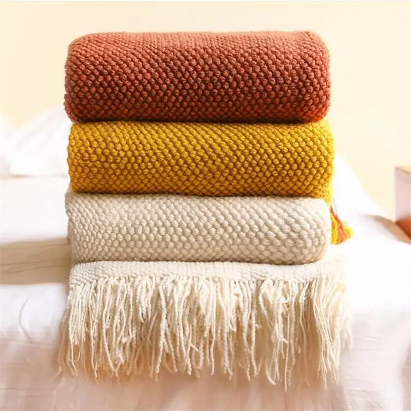 Plaid tricot nordique à carreaux avec pompons doux