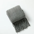 Plaid nordique carreaux style boheme doux pompons