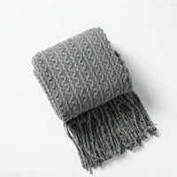 Plaid nordique carreaux style boheme doux pompons