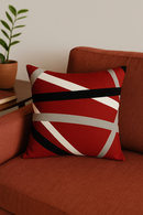 housse de coussin noire et rouge à motif géométrique