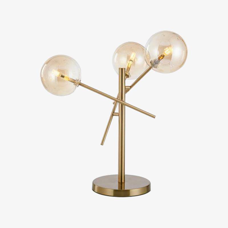 Lampe à poser design dorée et boules en verre