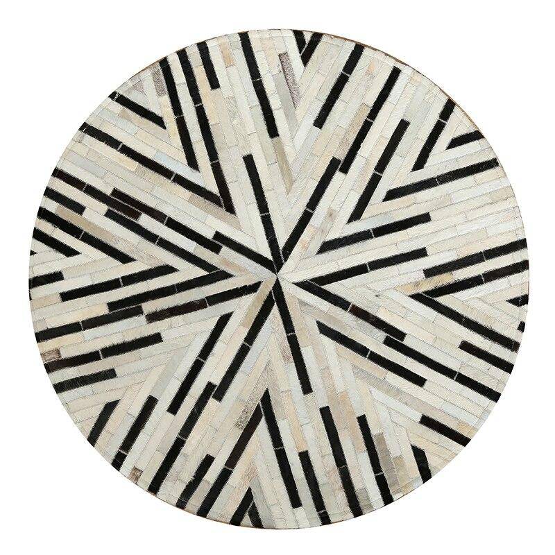 Tapis moderne rond aux formes géométriques noires et blanches Skin