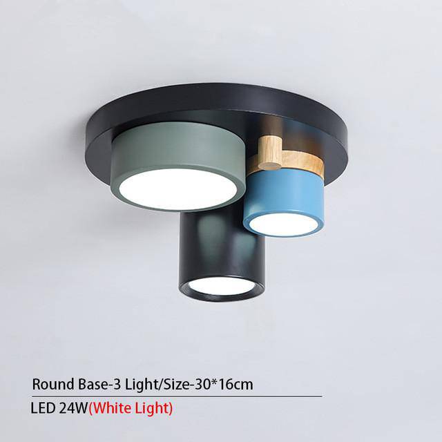 Plafonnier design avec plusieurs spots cylindriques colorés à LED