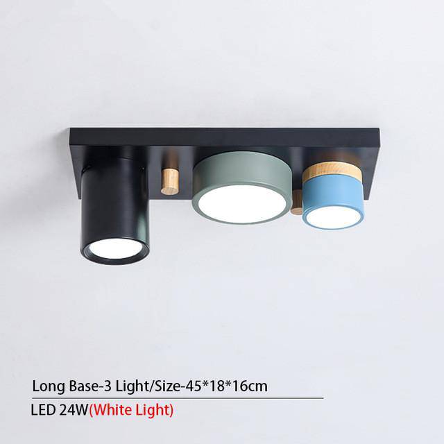 Plafonnier design avec plusieurs spots cylindriques colorés à LED