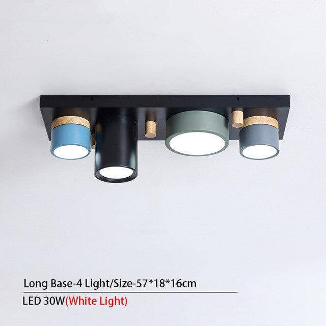 Plafonnier design avec plusieurs spots cylindriques colorés à LED