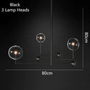 Lustre design LED base en métal doré et globes en verre Zuri