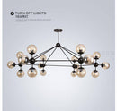 Lustre design noir avec plusieurs branches et verre Livewin