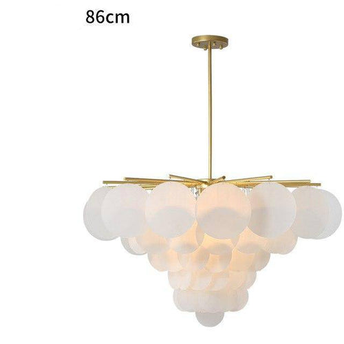 Lustre design avec branches dorées et boules en verre