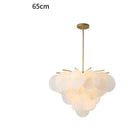 Lustre design avec branches dorées et boules en verre